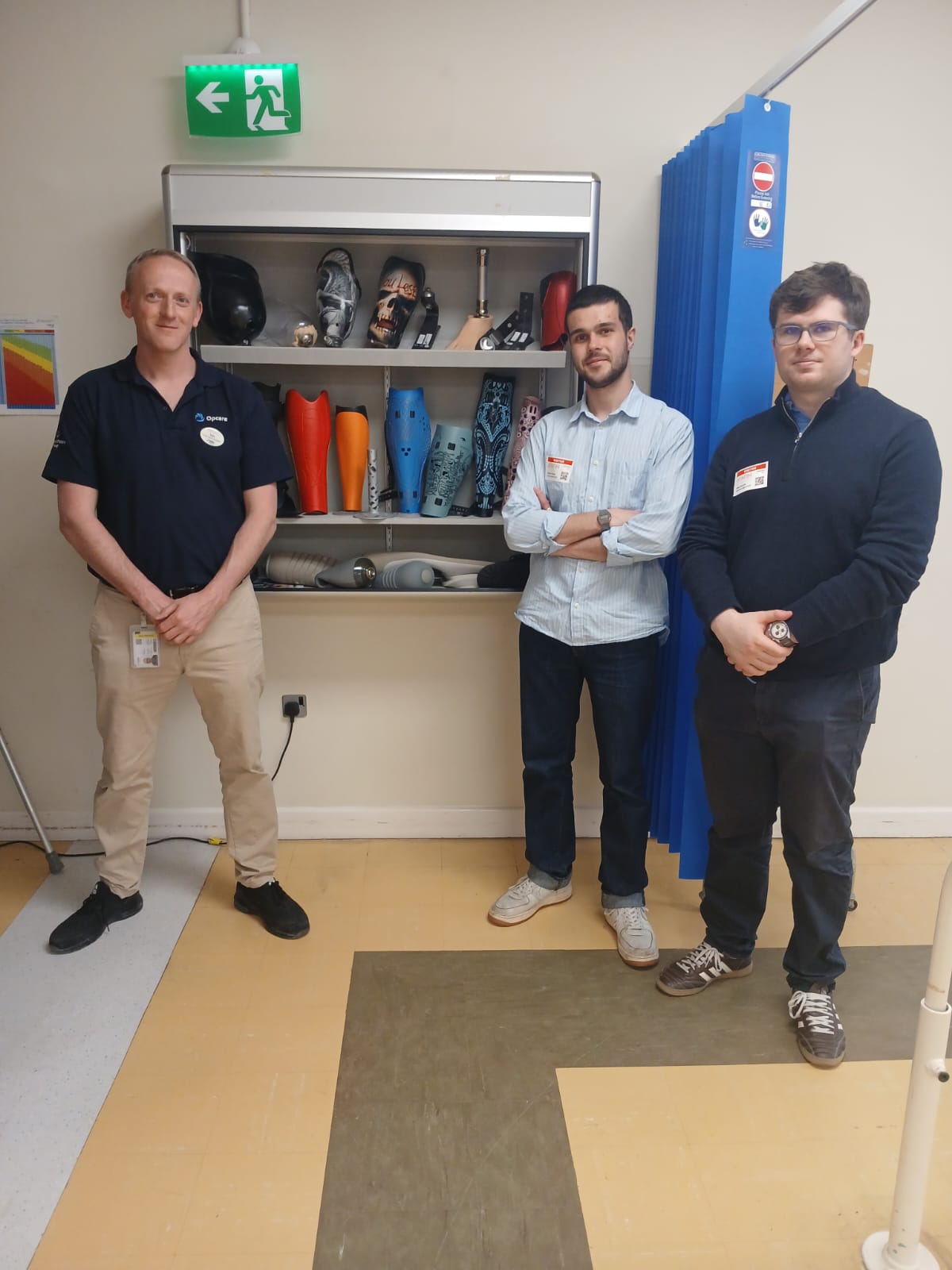Prosthetist Iain Briggs with William Hartley and Sean Barrett in the prosthetics clinic at the NRH
