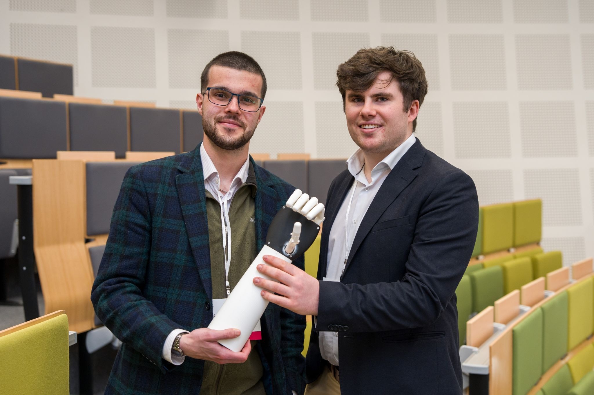 Sean Barrett and William Hartley holding the ReAble hand at UCD after the final.